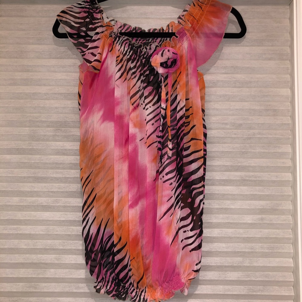 Women’s colourful off shoulder top.